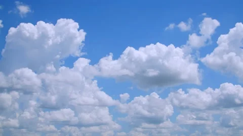 Large fluffy clouds in a blue sky on a spring day. 4k60p Stock Footage 132219658