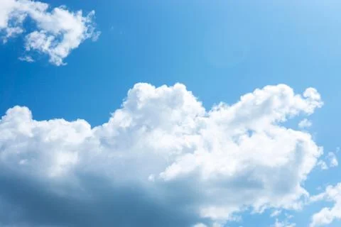 Large fluffy clouds in the blue sky. Stock Photos