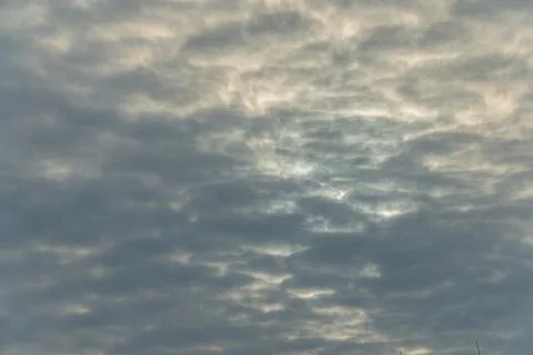 A large, fluffy white cloud dominates a serene sky backdrop, contrasted by sm Stock Photos