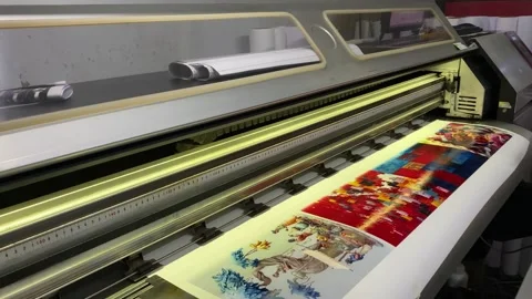 A large format printer creates vivid multicolor prints on wide paper rolls 库存影片 341636941