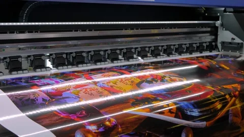 Large format printer is printing colorful promotional material Vídeos de archivo 343867813