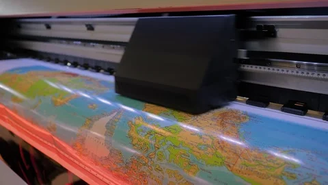 Large format printer is printing colorful promotional material Vídeos de archivo 343870515
