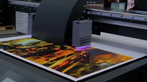 Large format printer is printing colorful promotional material Vidéo 344314595