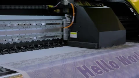 Large format printer is printing colorful promotional material Vídeos de archivo 344319573