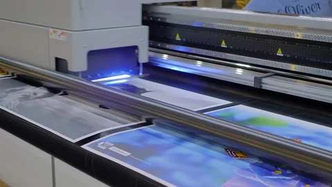 Large format printer is printing colorful promotional material 動画素材 347242886