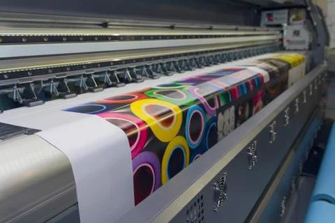 Large format printing machine in operation. Industry Stock Photos