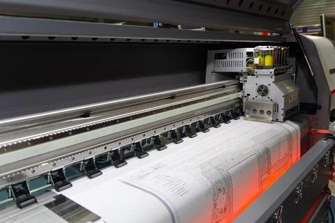 Large format printing machine in operation. Stock Photos