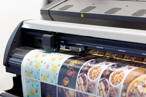 Large format printing machine in operation. Stock Photos