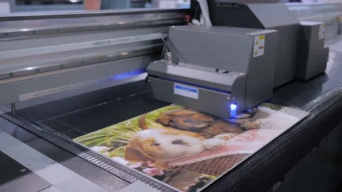 Large format printing - UV digital flatbed printer during work at printing house Stock Footage 148498413