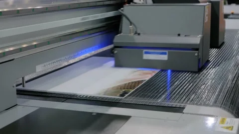 Large format printing - UV digital flatbed printer during work at printing house Stock Footage 149923651