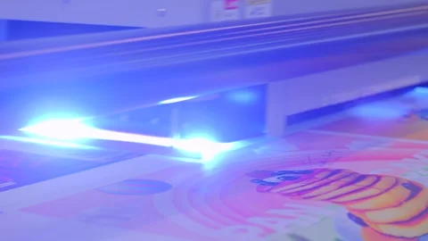 Large format UV digital flatbed printer prints colorful promotional material Stock Footage 278332990