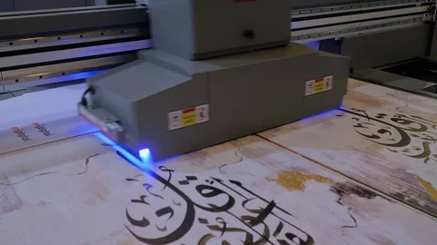 Large format UV digital flatbed printer prints colorful promotional material Stock Footage 278333308