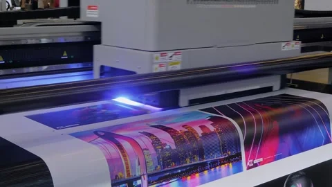 Large format UV digital flatbed printer prints colorful promotional material Stock Footage 278333363