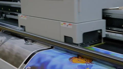 Large format UV digital flatbed printer prints colorful promotional material Stock Footage 329944050