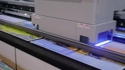 Large format UV digital flatbed printer prints colorful promotional material 動画素材 347248290