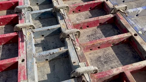 Large formwork board connected by clamps from several boards Stock Footage 240490767