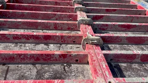 Large formwork board connected by clamps from several boards Stock Footage 243914911