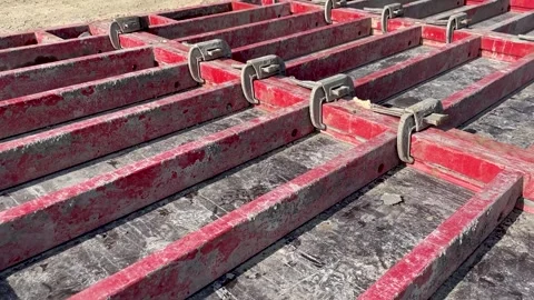 Large formwork board connected by clamps from several boards Stock Footage 245486912