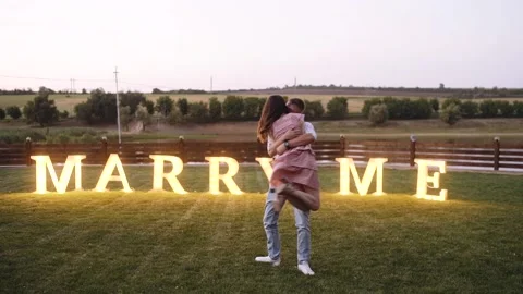 Large frame with two young romantics embracing outside in nature. Romantic Stock Footage 140849699