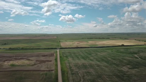 A large freight train travels through the valley shooting from a 4k drone Video stock 150684373