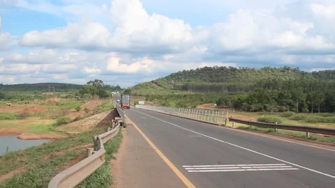 Large freight truck with a loaded container crosses the EN6 highway bridge Video stock 290204014