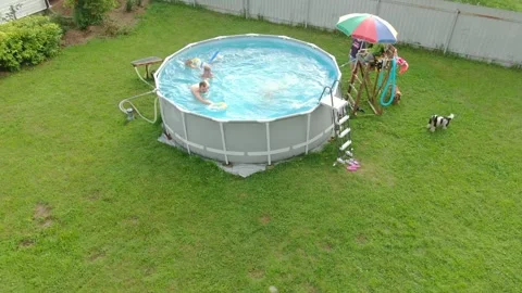 A large, friendly family is having fun in the pool. Stock-Footage 329276912