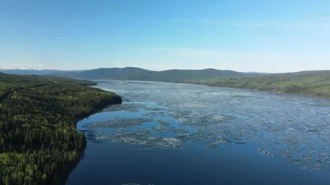A large frozen lake beginning to thaw, Blue Lake, Aerial View Stock Footage 289486151