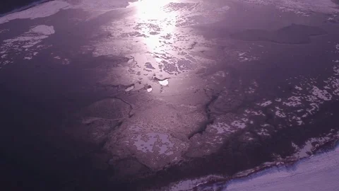 Large frozen lake in the middle of the forest, aerial photography, Russia, 4K Stock Footage 83574809