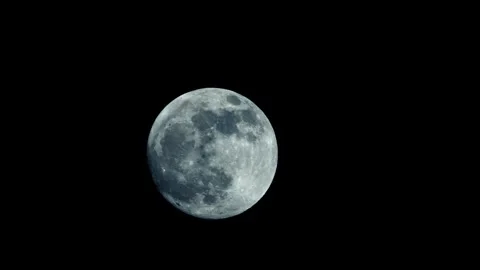 A large full moon moves slowly across the night sky Stock Footage 274316112