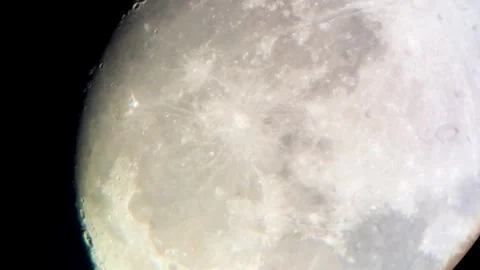 A large full moon in the night sky in a telescope lens. Close-up. Stock Footage 317749795