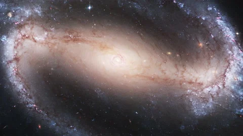 Large galaxy with space particles and stars around a fiery core Video stock 154140935