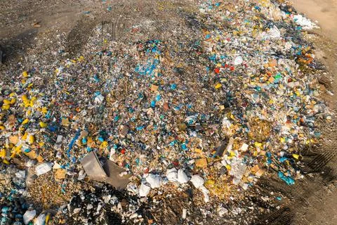 Large garbage dump with plastic bags and trash in the country. Environmental Stock Photos
