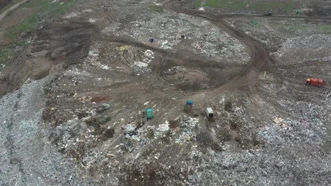 Large garbage dump view from the air. Garbage sorting. Cars and people sort Stock Footage 157175619