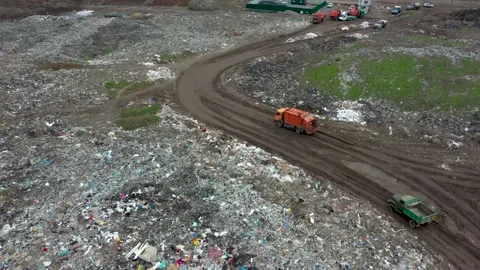Large garbage dump view from the air. Trucks carry rubbish. Garbage sorting Stock Footage 157175622