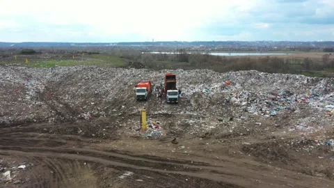 Large garbage dump view from the air. Trucks carry rubbish. Garbage sorting Stock Footage 157175733