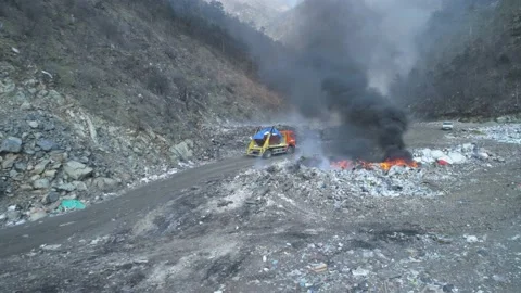 Large garbage landfill, burning trash with loth of polluting smoke Stock Footage 170696885