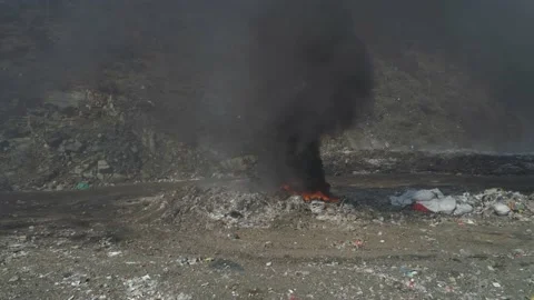 Large garbage landfill, burning trash with loth of polluting smoke Stock Footage 170697155