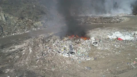 Large garbage landfill, burning trash with loth of polluting smoke Stock Footage 170698618