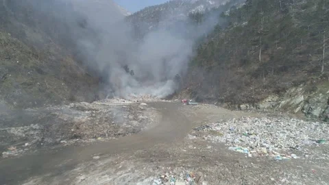 Large garbage landfill, burning trash with loth of polluting smoke Stock Footage 170699234
