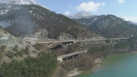 Large garbage landfill, trash dump close to clean mountain river Stock Footage 170699423