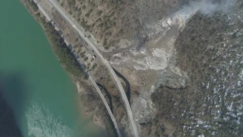 Large garbage landfill, trash dump close to clean mountain river Stock Footage 170699667