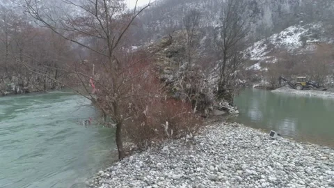 Large garbage landfill, trash dump close to clean mountain river Stock Footage 170699789