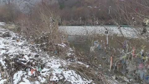 Large garbage landfill, trash dump close to clean mountain river Stock Footage 170700007