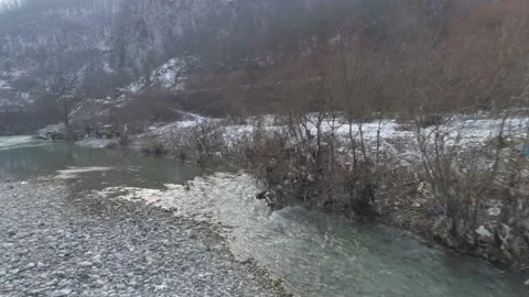 Large garbage landfill, trash dump close to clean mountain river Stock Footage 170700324