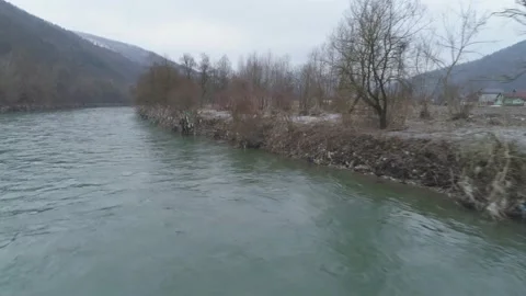 Large garbage landfill, trash dump close to clean mountain river Stock Footage 170700822