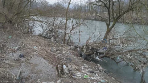 Large garbage landfill, trash dump close to clean mountain river Stock Footage 170700910