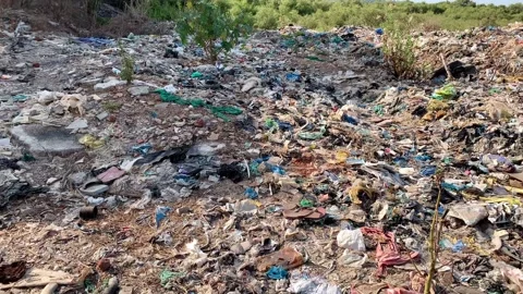Large garbage pile at Madh Island Mumbai Stock Footage 130968791