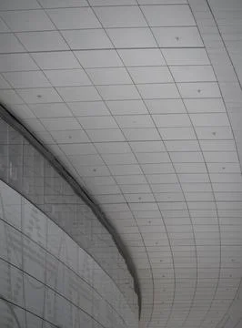 Large Geometric Curved Ceiling Panels in Minimalist Interior Stock Photos
