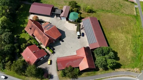 Large German farmstead with silo and barn in red brick style. Modern solar Stock Footage 315425792