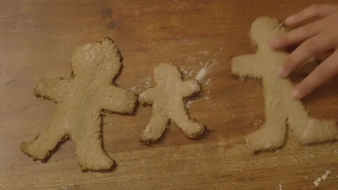 Large gingerbread biscuits placed next to small one Stock Footage 336374608